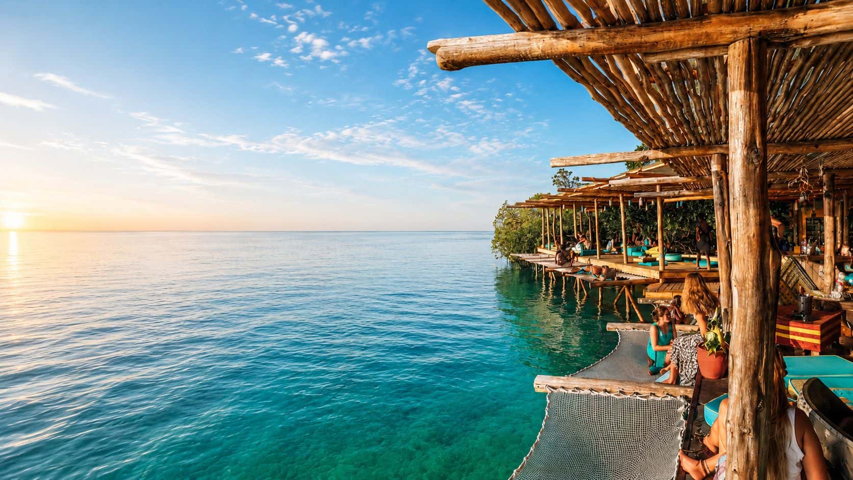 Overwater lounge at sunset on a Noma Collective Edition
